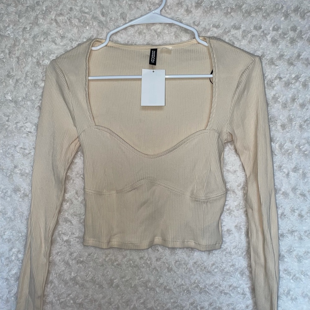 Super cute long sleeve ivory top. New with tags